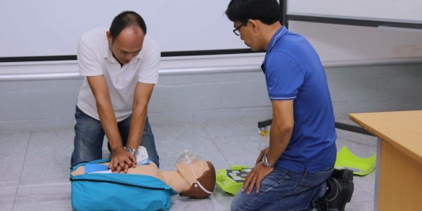 Mr. Phat performs a cardiopulmonary resuscitation, using an automated external defibrillator.